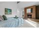 Inviting bedroom with a brick fireplace, creating a cozy atmosphere complemented by stylish decor and soft lighting at 999 N Emerson St # 10, Denver, CO 80218