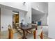 Open-concept dining room with tile floors, white walls, and a view into the living room at 999 N Emerson St # 10, Denver, CO 80218