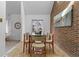 Charming dining room features a large window, ceramic tile flooring, and stylish furnishings at 999 N Emerson St # 10, Denver, CO 80218