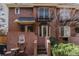 Charming home exterior with fountain feature, small balcony and landscaped entryway at 999 N Emerson St # 10, Denver, CO 80218