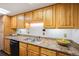 Kitchen with laminate countertops, lots of cabinet space, and black appliances at 999 N Emerson St # 10, Denver, CO 80218
