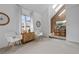 Open living room showcasing vaulted ceilings, neutral decor, brick accents, and dining area at 999 N Emerson St # 10, Denver, CO 80218