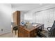 Office featuring classic wood desk and decorative wall clock, and access to more living space in the home at 999 N Emerson St # 10, Denver, CO 80218