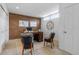 Office with exposed brick wall, complemented by a classic wood desk, two chairs, and a decorative wall clock at 999 N Emerson St # 10, Denver, CO 80218