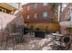 Outdoor patio with multiple seating areas, including high top chairs, and a brick surface, offering a relaxing space at 999 N Emerson St # 10, Denver, CO 80218