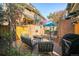 Backyard patio with lounge seating, dining table, and mature landscaping for outdoor enjoyment at 999 N Emerson St # 10, Denver, CO 80218