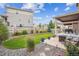 Landscaped backyard featuring a patio, fire pit, and a well-maintained lawn, perfect for outdoor entertaining at 2008 Makley Loop, Castle Rock, CO 80104