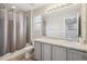 Neutral bathroom featuring modern fixtures, shower/tub combo, and a large vanity at 2008 Makley Loop, Castle Rock, CO 80104