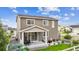Rear exterior view showcases patio, well-manicured lawn, and privacy fence, highlighting outdoor living space at 2008 Makley Loop, Castle Rock, CO 80104