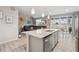 Open kitchen and living area with granite countertops, stainless appliances, and great natural lighting at 2008 Makley Loop, Castle Rock, CO 80104