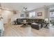 Spacious living room with hardwood floors, a large sectional couch, and natural light at 2008 Makley Loop, Castle Rock, CO 80104