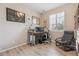 Home office featuring a large window, wood floors, and modern desk at 2008 Makley Loop, Castle Rock, CO 80104