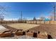 Spacious backyard offers potential for gardening, with a large lawn and garden beds at 6699 S Pennsylvania St, Centennial, CO 80121