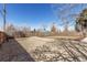 A backyard with a rock area and fresh sod is surrounded by a new wooden fence at 6699 S Pennsylvania St, Centennial, CO 80121