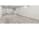 Spacious finished basement with gray carpet, built-in cabinets, and ample lighting at 6699 S Pennsylvania St, Centennial, CO 80121