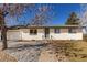 Charming single-story brick home with a well-manicured lawn and inviting front entrance, plus attached garage at 6699 S Pennsylvania St, Centennial, CO 80121