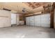 Spacious two car garage with an unfinished ceiling and neutral painted walls at 6699 S Pennsylvania St, Centennial, CO 80121