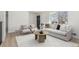Inviting living room featuring a modern couch, stylish furniture, a large window, and lots of natural light at 6699 S Pennsylvania St, Centennial, CO 80121