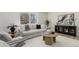 Cozy living room features a modern couch, stylish furniture, a large window, and lots of natural light at 6699 S Pennsylvania St, Centennial, CO 80121