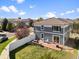 Aerial view showcasing the backyard, patio, and neighborhood setting of this property at 5555 Perth Ct, Denver, CO 80249