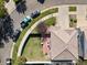 Aerial view of a home featuring a well-kept lawn, patio with seating, and mature landscaping in a suburban neighborhood at 5555 Perth Ct, Denver, CO 80249