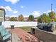 Outdoor patio area with grill, seating, and lush green lawn, perfect for entertaining at 5555 Perth Ct, Denver, CO 80249
