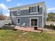 Backyard featuring a patio with a grill, seating area, and a well-maintained lawn at 5555 Perth Ct, Denver, CO 80249