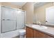 Bathroom featuring a vanity with sink, toilet, and a shower with glass sliding doors at 5555 Perth Ct, Denver, CO 80249