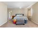 Neutral bedroom with chandelier, soft carpet, and an alcove for added space at 5555 Perth Ct, Denver, CO 80249