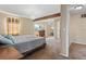 Bedroom with decorative ceiling fixture, carpet, and window with coverings at 5555 Perth Ct, Denver, CO 80249