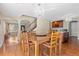 Open dining area with hardwood floors, chandelier, and easy access to the kitchen at 5555 Perth Ct, Denver, CO 80249
