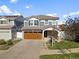 Charming two-story home with a well-manicured lawn and attached two-car garage at 5555 Perth Ct, Denver, CO 80249