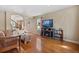 Spacious living room with fireplace and hardwood floors is perfect for entertaining guests or relaxing at 5555 Perth Ct, Denver, CO 80249