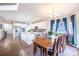 Kitchen with an adjacent dining area featuring hardwood floors and a wooden table at 1682 Dorothy Cir, Longmont, CO 80503