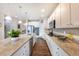 Kitchen with granite countertops, stainless steel appliances, and hardwood floors at 1682 Dorothy Cir, Longmont, CO 80503