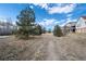 Pathway through open, grassy backyard at 4272 E Orchard Pl, Centennial, CO 80121