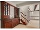 Finished basement with wet bar and staircase at 4272 E Orchard Pl, Centennial, CO 80121