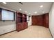 Finished basement room with built-in bookcases at 4272 E Orchard Pl, Centennial, CO 80121