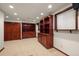 Finished basement office with built-in shelving and cabinets at 4272 E Orchard Pl, Centennial, CO 80121