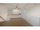 Upstairs hallway with carpet, ceiling fan, and double doors at 4272 E Orchard Pl, Centennial, CO 80121