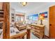 Bedroom with log bunk beds, accent chair, natural wood dresser and mountain-themed décor at 290 Broken Lance Dr # B202, Breckenridge, CO 80424