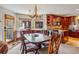 Charming dining area with a unique chandelier and access to the kitchen at 290 Broken Lance Dr # B202, Breckenridge, CO 80424