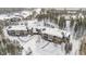 Elegant condo complex with balconies surrounded by a snow-covered landscape at 290 Broken Lance Dr # B202, Breckenridge, CO 80424
