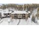 Charming condo building featuring multiple balconies and snow-covered front entrance at 290 Broken Lance Dr # B202, Breckenridge, CO 80424
