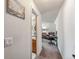 Bright hallway leads to a full bathroom and a bedroom sitting area with desk and comfortable furniture at 290 Broken Lance Dr # B202, Breckenridge, CO 80424
