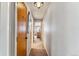 Hallway featuring neutral carpet and paint with a view of a small desk area at 290 Broken Lance Dr # B202, Breckenridge, CO 80424