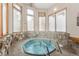 Indoor hot tub area with stone accents and frosted windows for privacy at 290 Broken Lance Dr # B202, Breckenridge, CO 80424