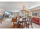 Living space featuring an open layout with a stone fireplace and dining area at 290 Broken Lance Dr # B202, Breckenridge, CO 80424