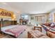 Open living area with a stone fireplace, sleeper sofa and comfortable seating at 290 Broken Lance Dr # B202, Breckenridge, CO 80424