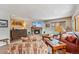 Inviting living room with a stone fireplace, stylish furniture, and large windows at 290 Broken Lance Dr # B202, Breckenridge, CO 80424